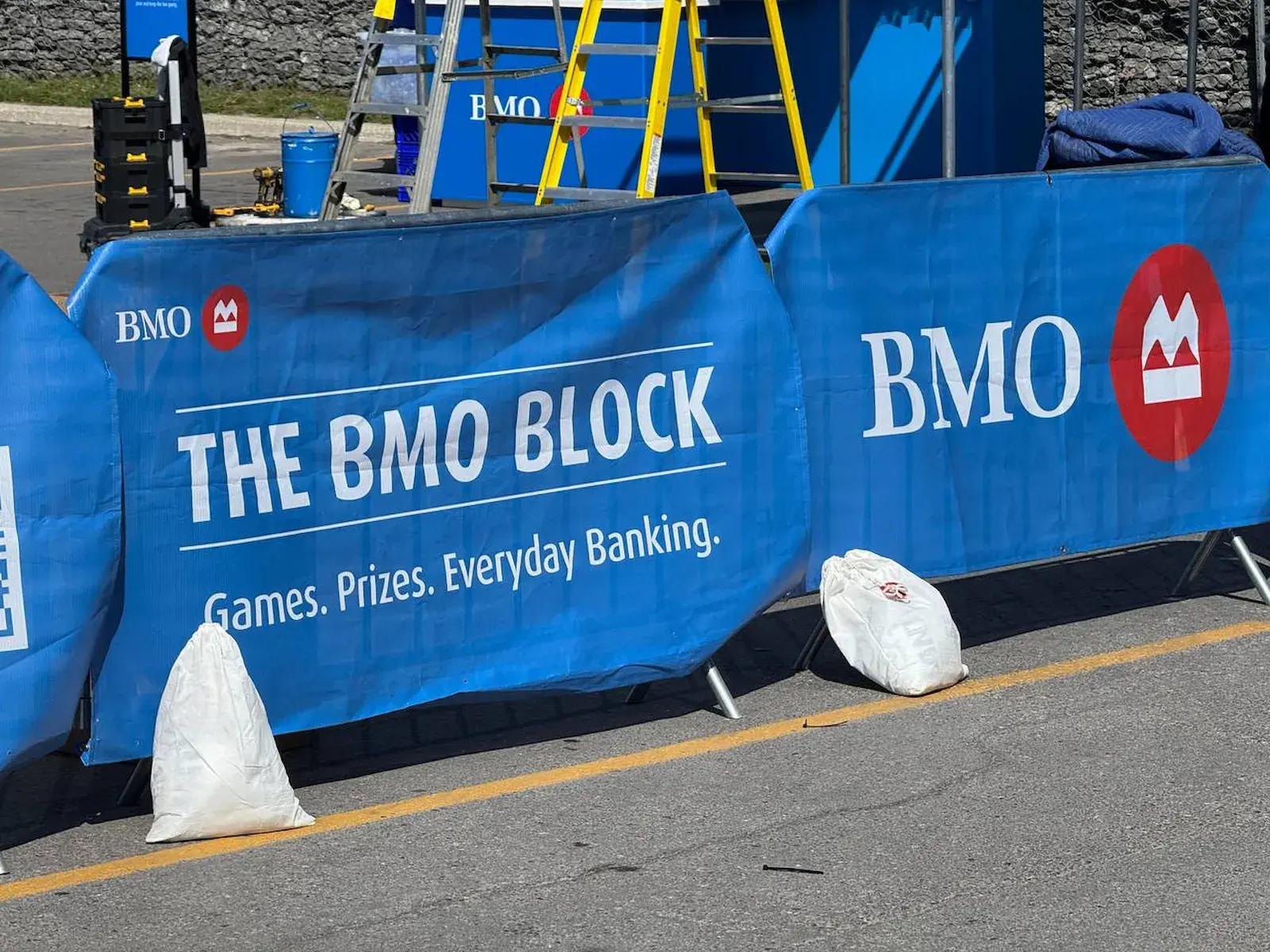 A run of crowd control fencing set up outdoors at a Toronto event.